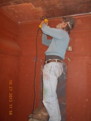 Mark using the DeWalt grinder to wirewheel the ceiling of women's washroom  DSCN0645