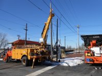 New steel pole installed to replace rotted wood pole.  Extension is needed to provide clearence between trolley bus wires and signal & telephone cables.