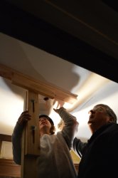 Getting the ceiling panel in place. 