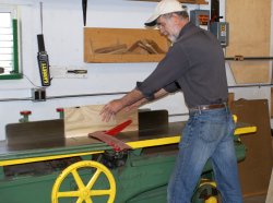 Yours truly running replacement Depot Door panels through the jointer after blade replacement. Photo by Buzz Morisette.