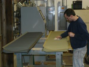 Kyle wiping the DB louvers to get them ready for paint.