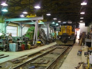 CNW 6847 in the steam shop next to the large wheel lathe and over head crane.