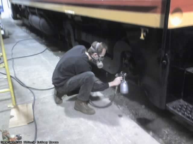 Jamie painting trucks and tanks on CBQ 9255