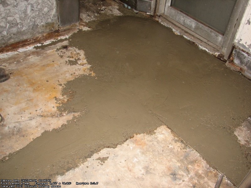 The concrete application by the door is done. 