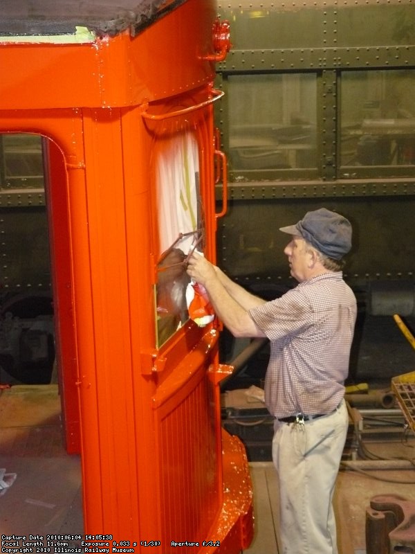 Randy removing masking from the windows.