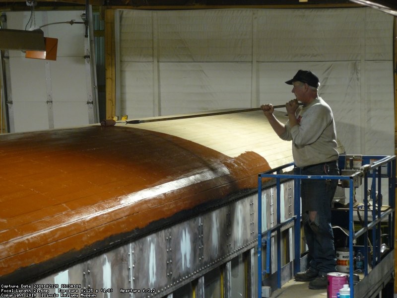 Jeff painting/sealing the wood roof.