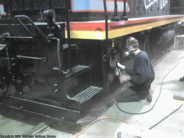 Jamie painting trucks and tanks on CBQ 9255