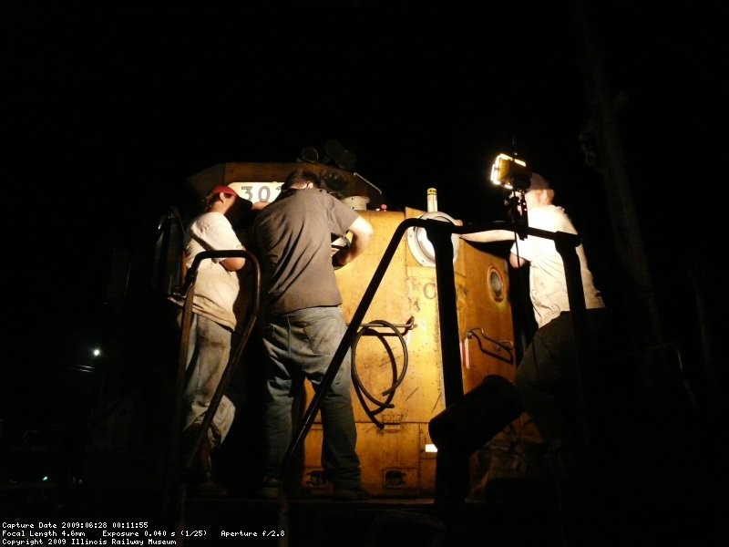 Steve L, Charlie S and Warren L attempting the repairs of the class lights.