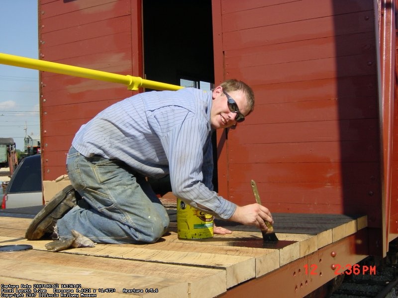 08.12.07 - MARK ST. GERMAIN STARTS TO STAIN THE NEW DECK BOARDS WHICH WERE PUT INTO PLACE BY KIRK WARNER AND MARK.