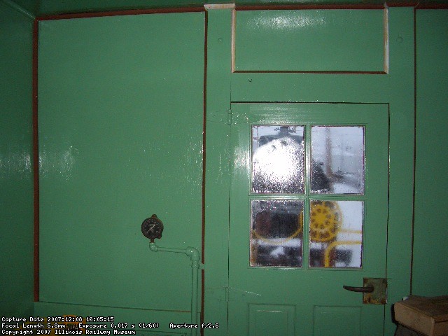 12.08.07 - THE CEILING HAS BEEN PATCHED IN AT THE VERTICAL DOOR SUPPORTS.  ALL OF THE REMAINING QUARTER ROUND HAS BEEN PRIMED AND INSTALLED. NOTE THE ICE ON THE DOOR WINDOW PANES. IT IS 16 DEGREES OUTSIDE. 