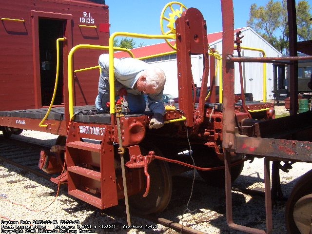 05.28.08 - KIRK WARNER DRILLS THROUGH WOOD AND STEEL TO APLLY ADDITIONAL DECK BOLTS.