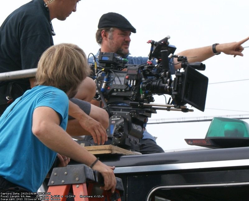 Cinematographers atop a fire truck with Arri (Arriflex) HD camera, camera has no film but records electronically to memory card. 