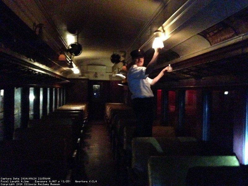 Brian Patterson lighting the coach train - Photo by Warren Newhauser