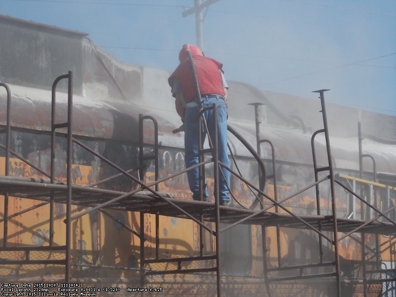 Chuct Trabert began sandblasting before noon - Photo by Jane Pomazal