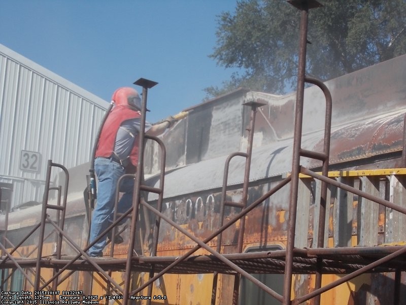 Another shot of Chuck T sandblasting - Photo by Jane Pomazal