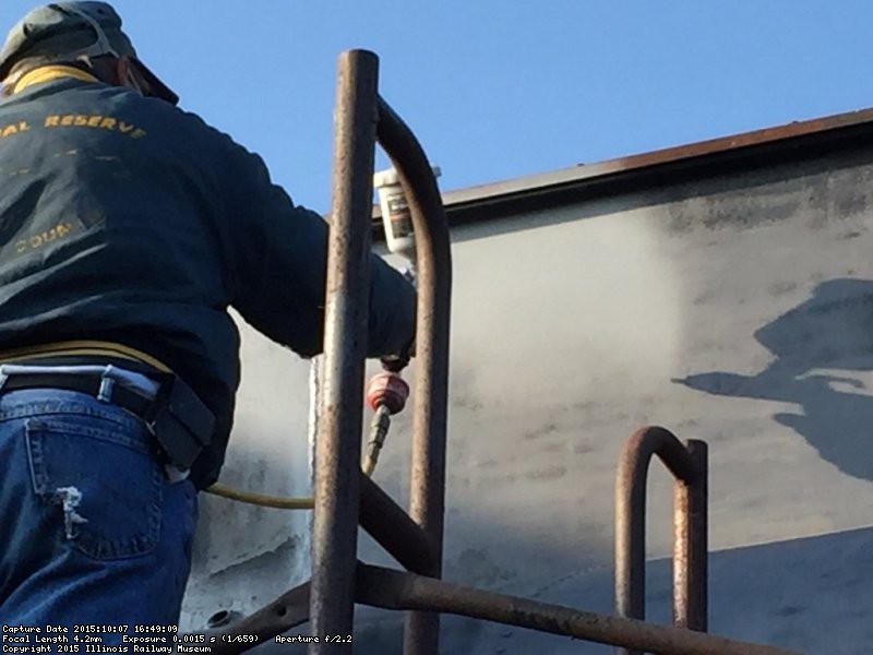 It was near 5pm when Chuck Pomazal started applying primer - Photo by Warren Newhauser