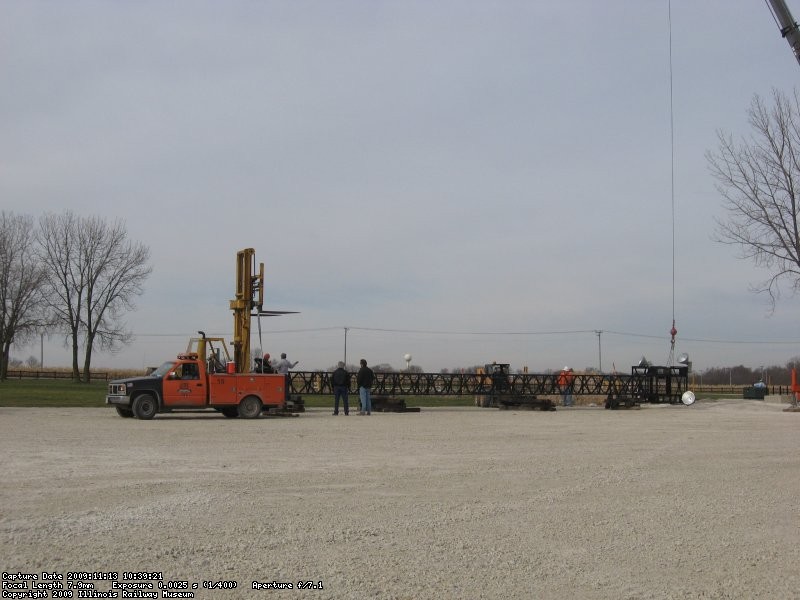 The forklift gets into position to keep the bottom from dragging as the top is lifted.