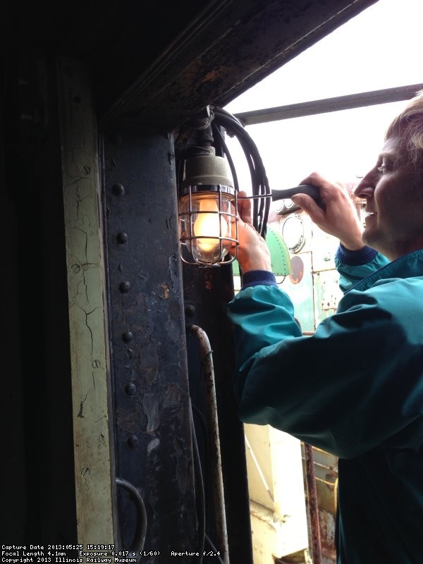 Larry is seen securing a jelly jar light