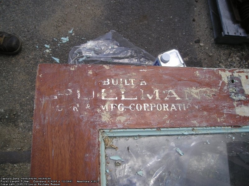 July 10, 2003, stripping of interior paint from the end doors reveals the pullman logo on this door.