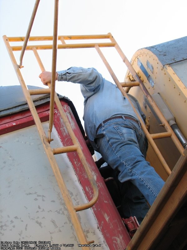 Mike Baksic working on the temporary diaphragm between Exhibit Cars 