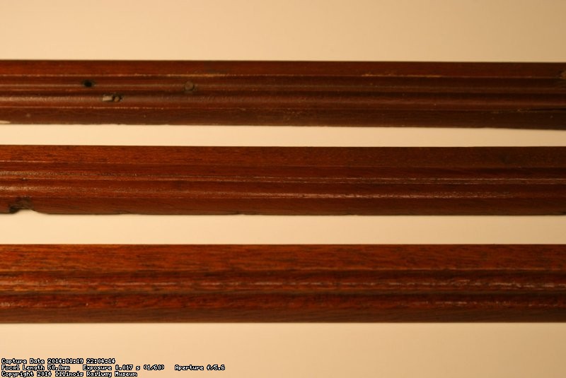 Front to back: new, refinished, and original finish trim