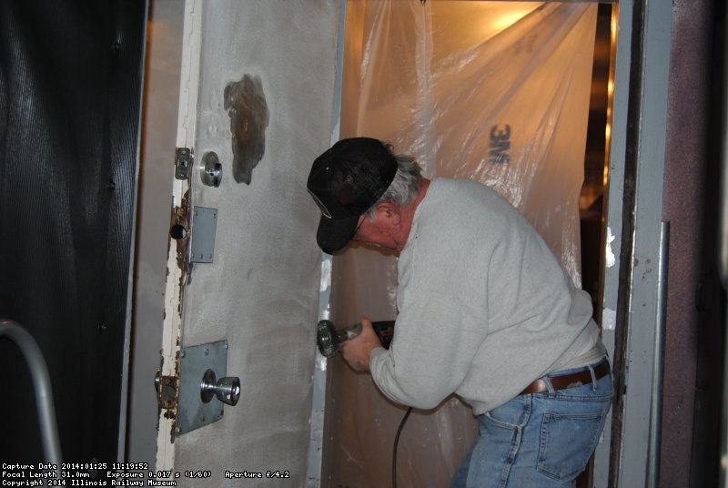 Kevin removing the high spots in the vestibule