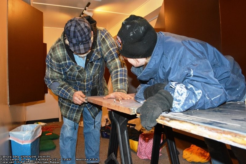 Mike Baksic and Shelly Vanderschaegen planing the door edge for the 2nd Exhibit Car