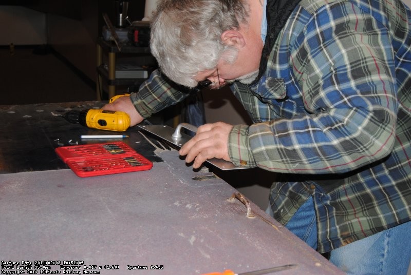 Mike lining up the door handle faceplate