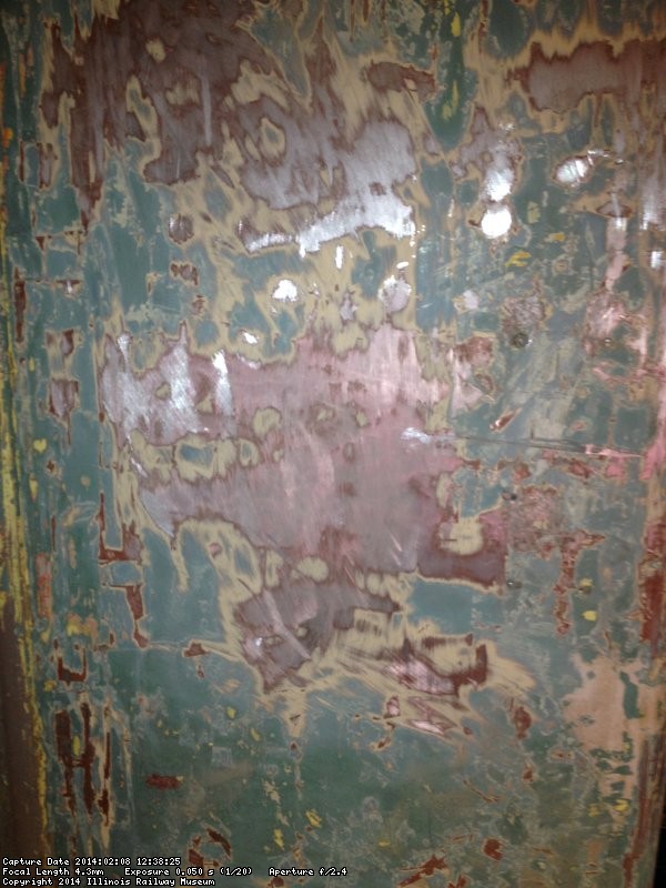 Wall by the divider showing some stainless steel