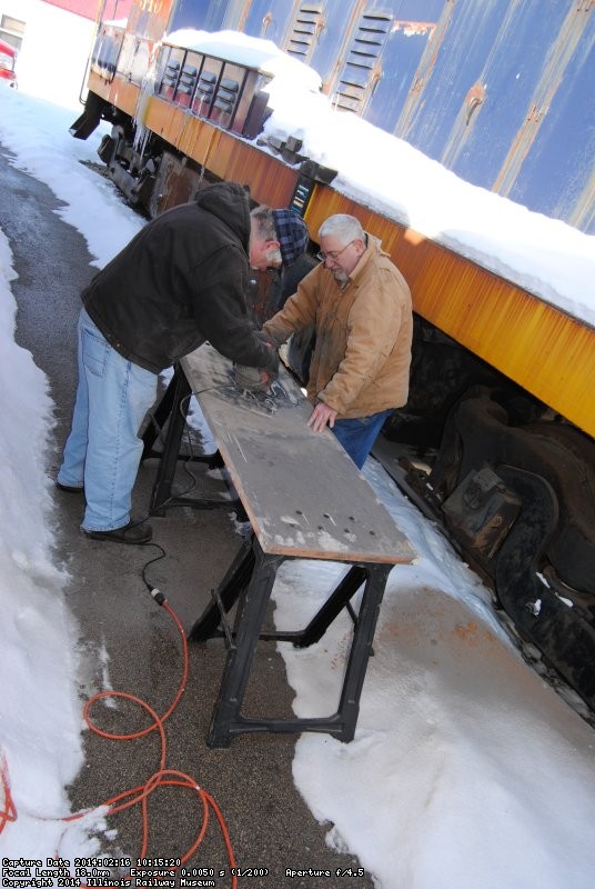 Mike and Mark Gellman sanding the vestibule closet door 2/16/14