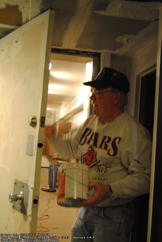 Kevin Kriebs applying primer in the vestibule between the Exhibit Cars 2/22/14