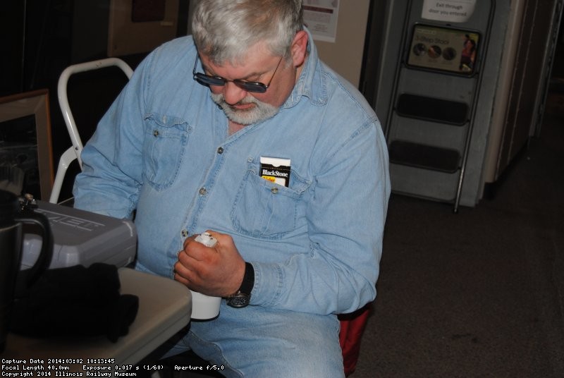 Mike Baksic modifying a light fixture for the 2nd Exhibit Car