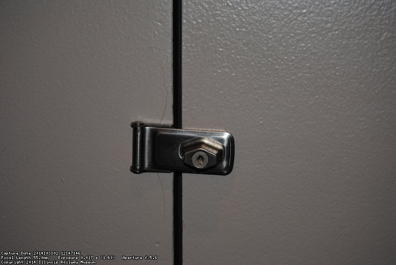 Mark Gellman and Michael Baksic installed a lock on a door in the 2nd Exhibit Car