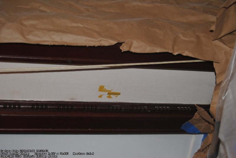 Gold leaf showing through where paint was scraped off 