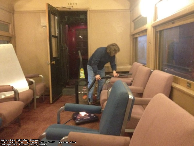 Shelly Vanderschaegen vacuuming the ATSF Lounge Car - image by Michael McCraren