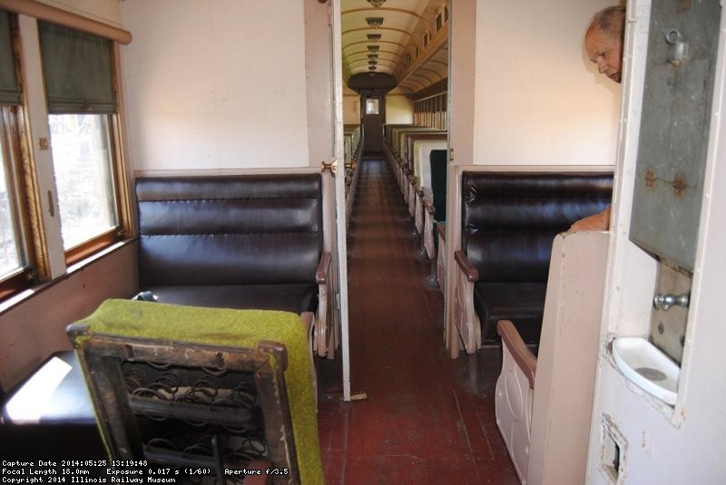 John McKelvey peeks at the DM&IR 84 coach smoking section - Photo by Shelly Vanderschaegen