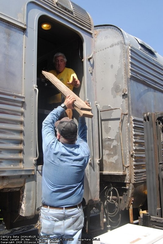 Michael Baksic and Mark Gellman building a platform to hold one of the air conditioners - Photo by Shelly Vanderschaegen