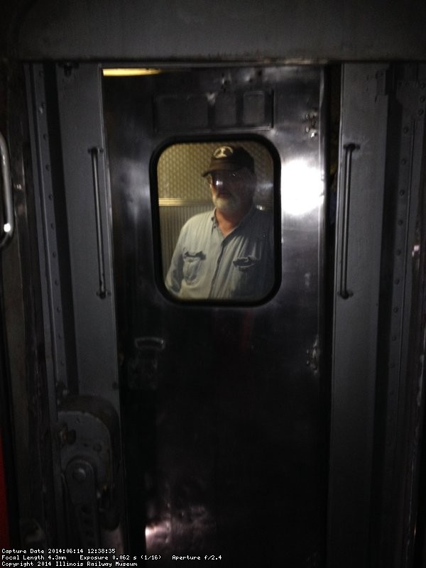 Michael Baksic looks through the Birmingham kitchen door as it is being installed - Photo by Michael McCraren