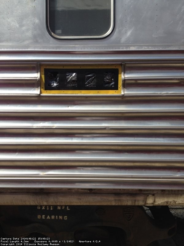 Michael masked the area painted black on the south side and sprayed on the yellow paint - Photo by Michael McCraren