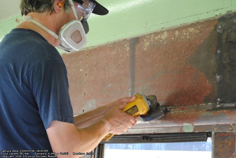 Closer shot of Mark grinding the surface smooth - Photo by Shelly Vanderschaegen