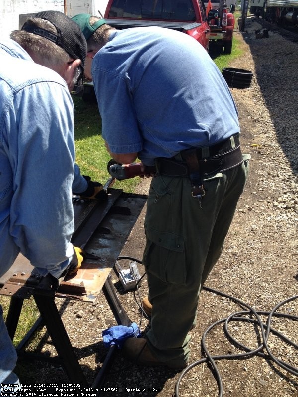 Ray Mormann and Mike Baksic work on the door bottom - Photo by Michael McCraren