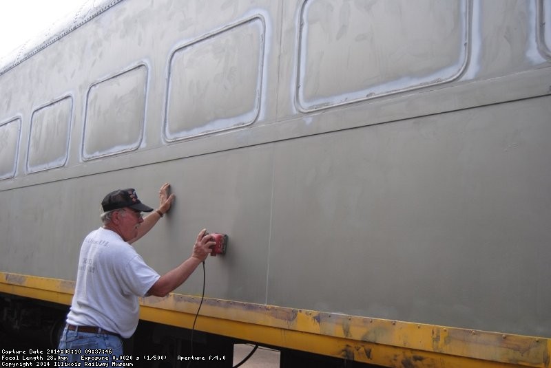 Kevin Kriebs is scuffing the exterior of the 1st Exhibit Car - Photo by Shelly Vanderschaegen
