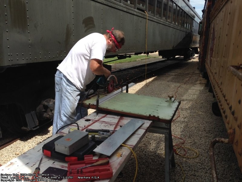 Chuck Trabert cutting off the lower panel area - Photo by Warren Newhauser
