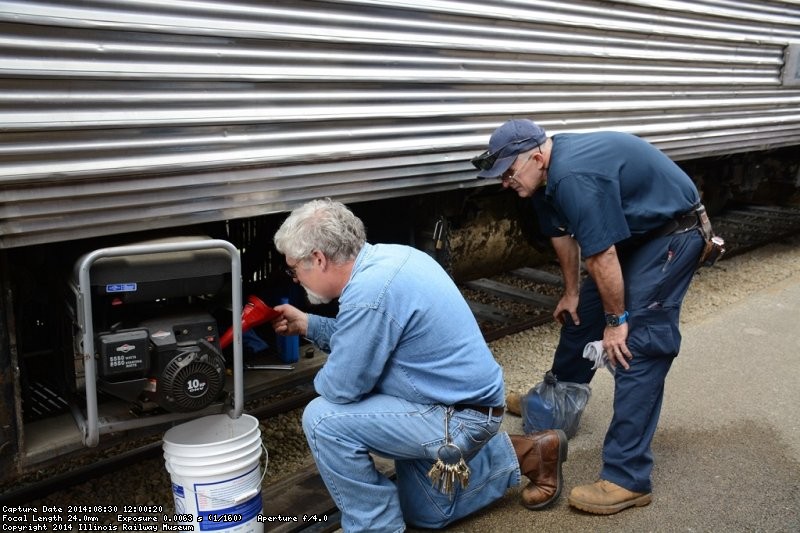 Michael Baksic and Ray Mormann work on a generator - Photo by Jon Habegger