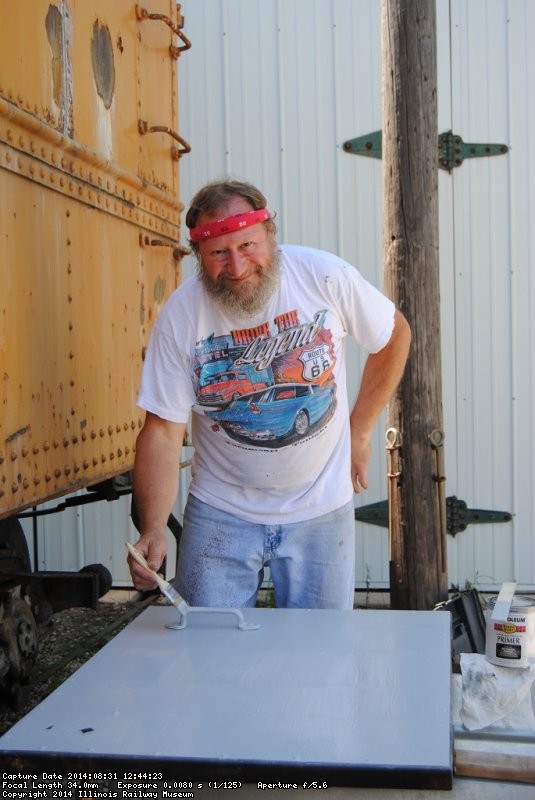 Chuck Trabert painting a refurbished Dynamometer door - Photo by Shelly Vanderschaegen