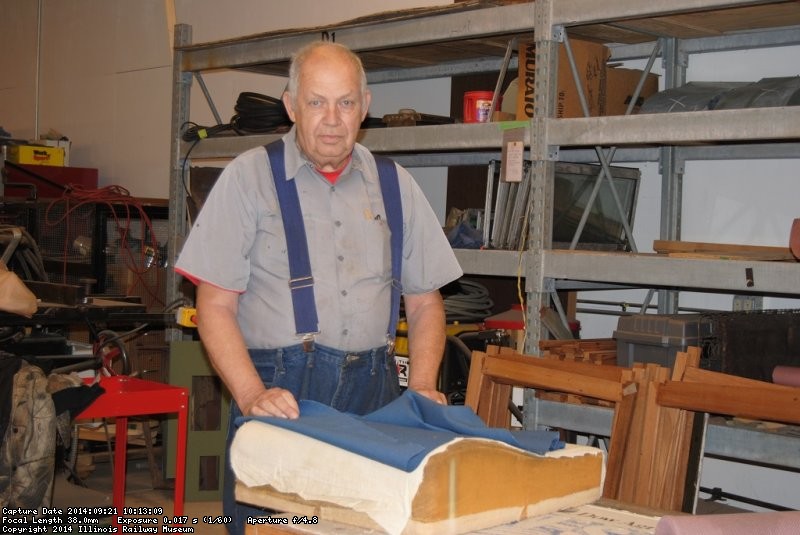 John McKelvey with material from a Santa Fe Lounge Car seat - Photo by Shelly Vanderschaegen