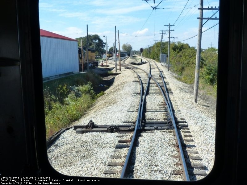 The Denver Zephyr is about to take the switch into the station, note Mike Blackwell in the distance ready to realign the switches once we get through shop - Photo by Kevin Brown using Brian LaKemper's camera