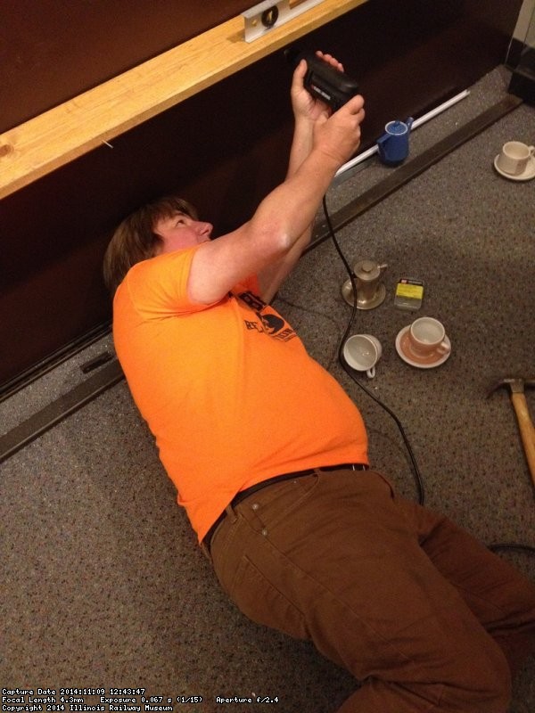 Mark installed the lower shelf inside the display case - Photo by Michael McCraren