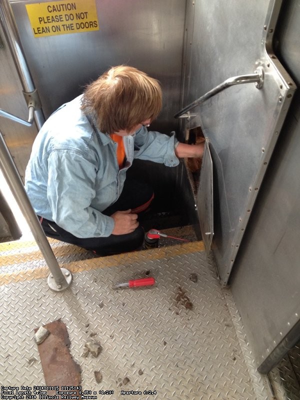Mark Gellman working on making the sliding door function better - Photo by Michael McCraren