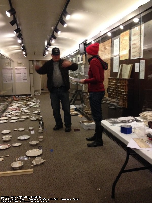 Jim Windmeier talks over the china exhibit with guest Patrice Connelly - Photo by Michael McCraren